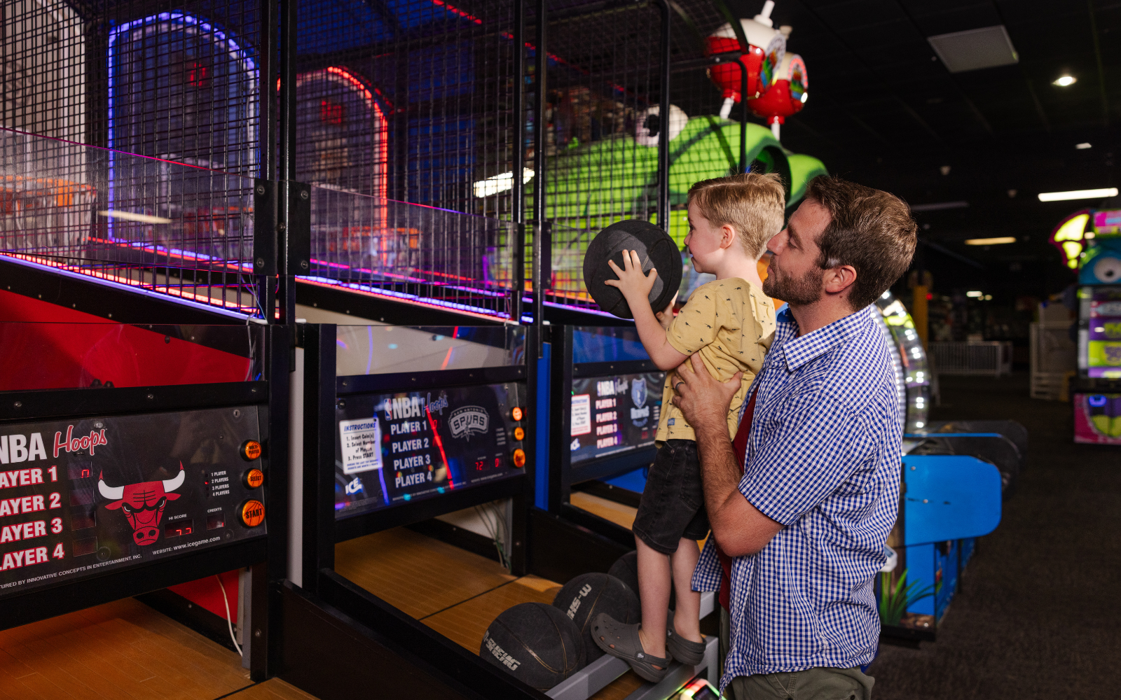 Family playing together in arcade