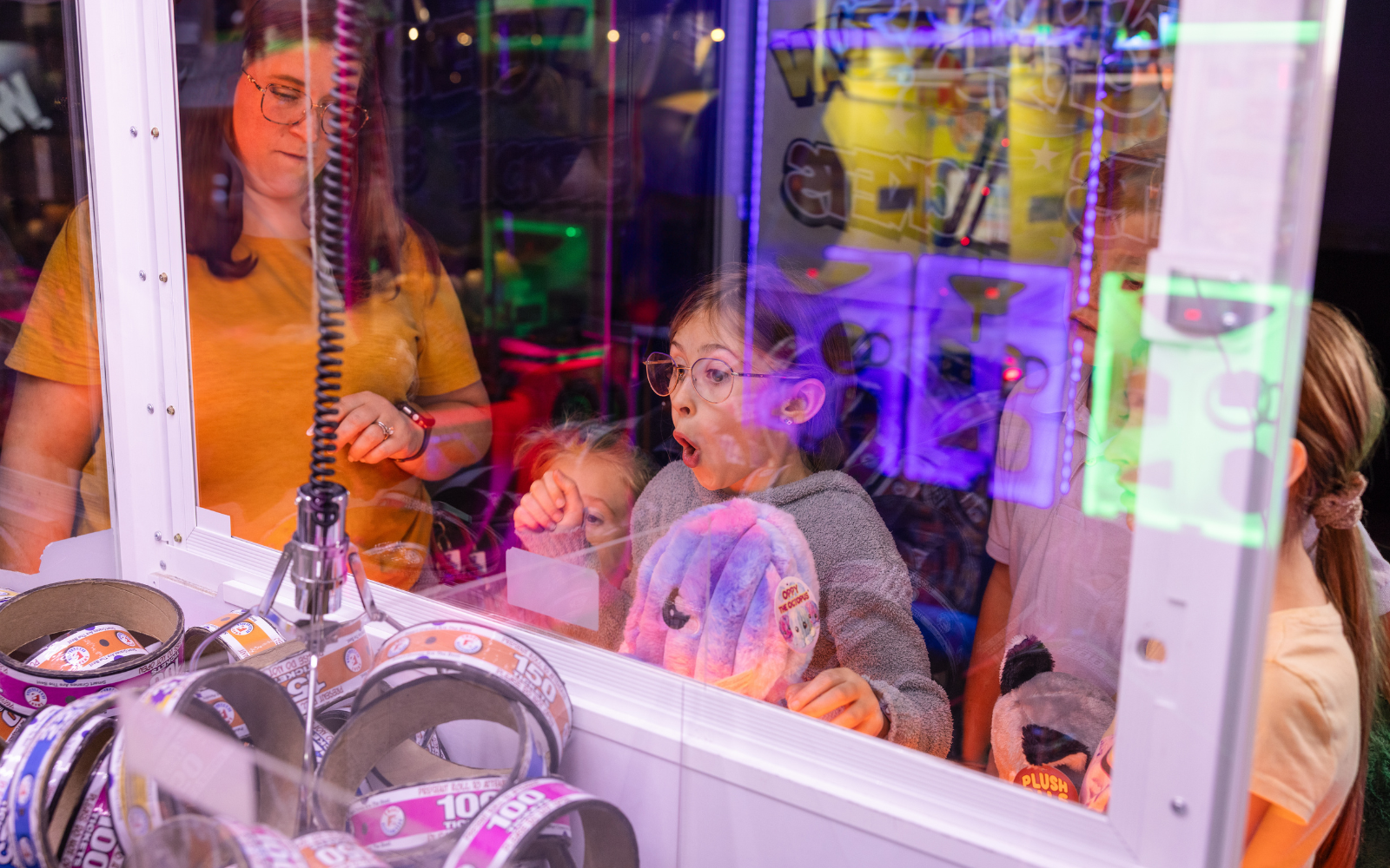 Guest playing a crane machine