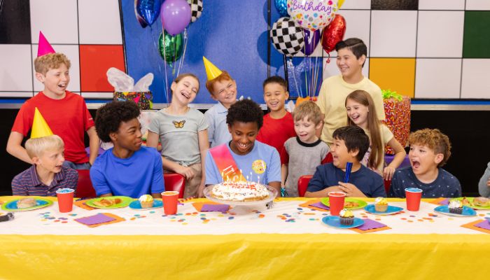 Kids birthday party package — decorated table and happy guests