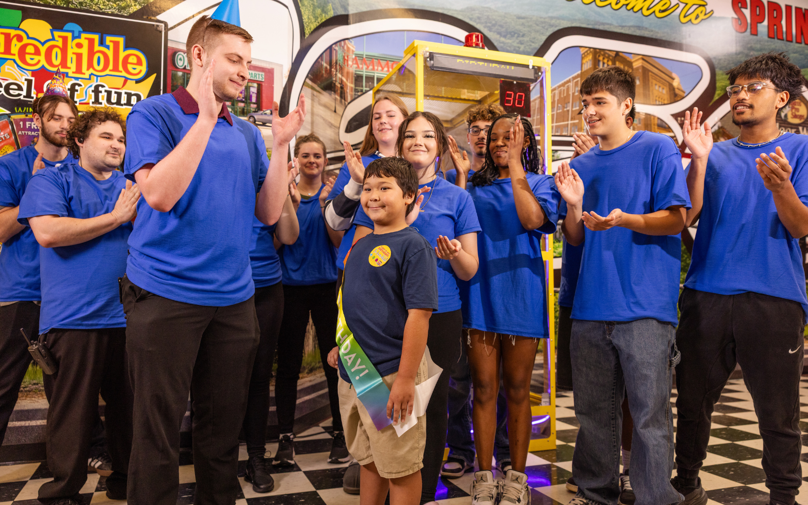 Incredible Pizza team members celebrating with guests